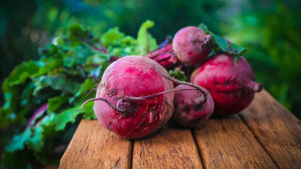 Fresh beetroots on a wooden table, representing food sensitivity testing